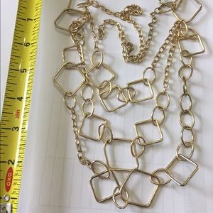 Shiny goldtone adjustable length necklace.